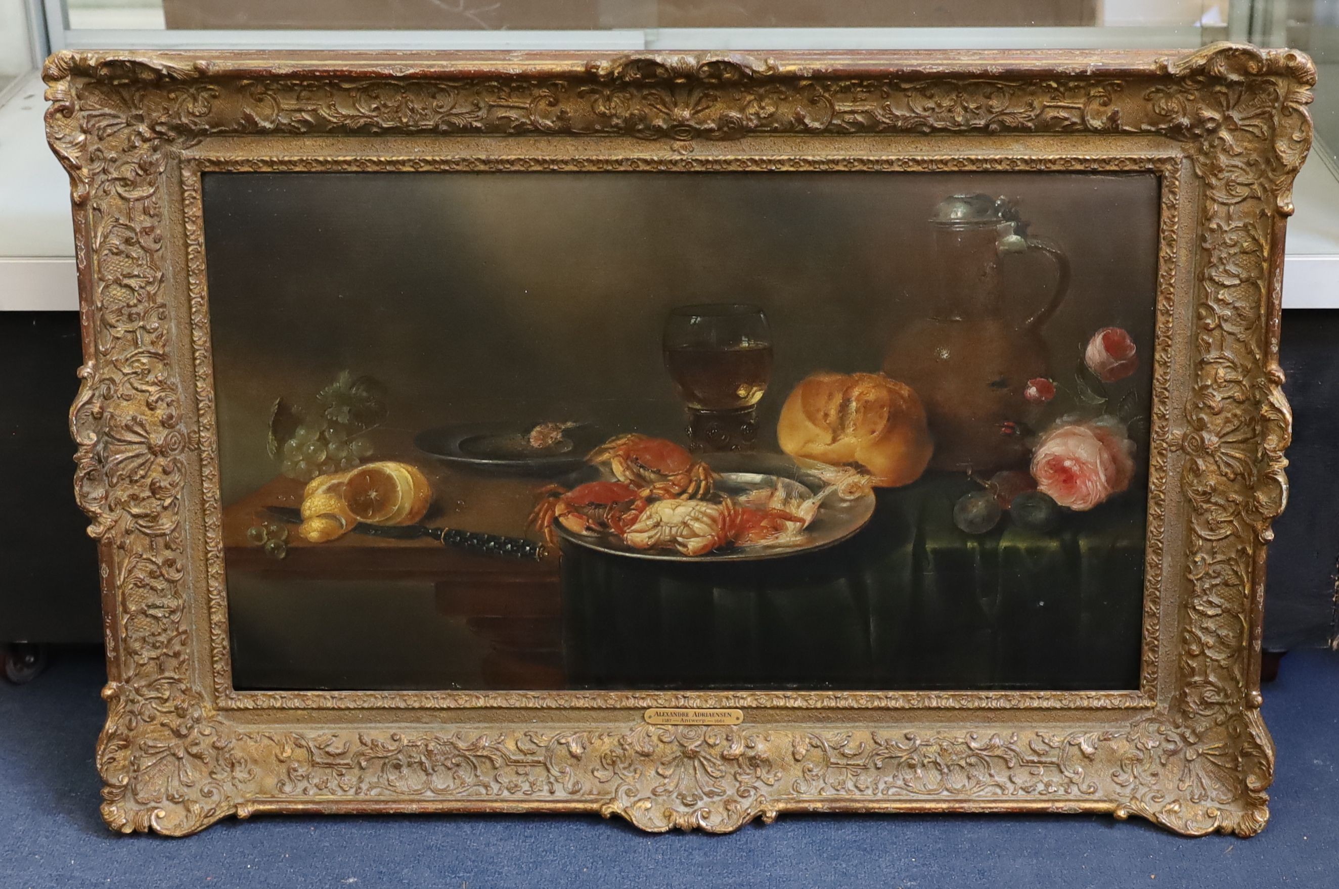 Alexandre Adriaensen (1587-1661), Still life of crabs, fruit, a loaf of bread, rummer, flagon and flowers upon a table top, oil on wooden panel, 40 x 70cm.